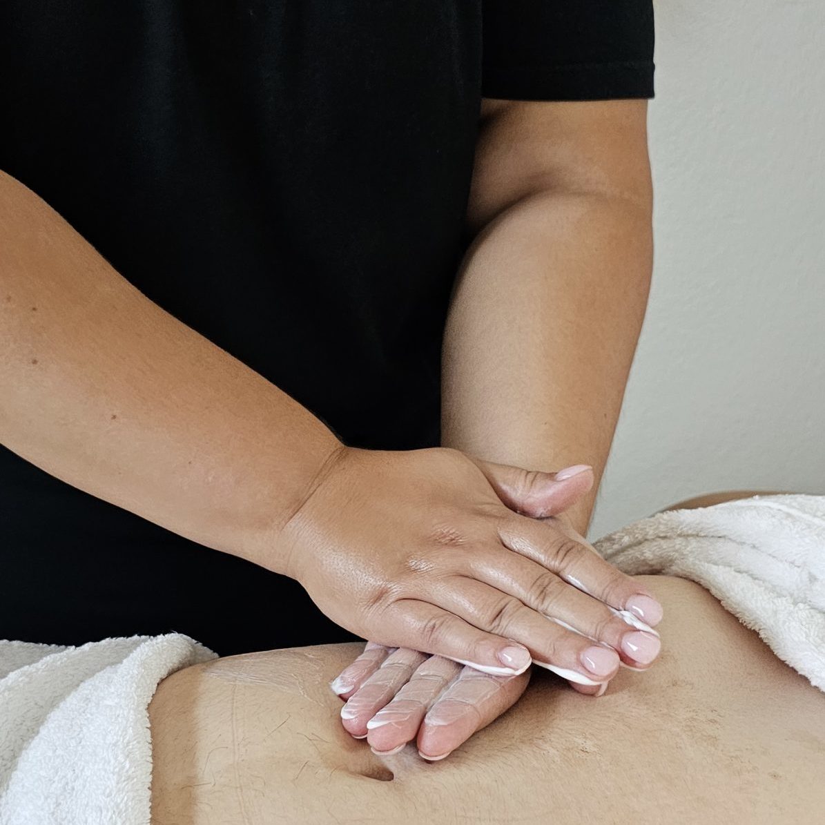 a woman getting a back massage at a spa